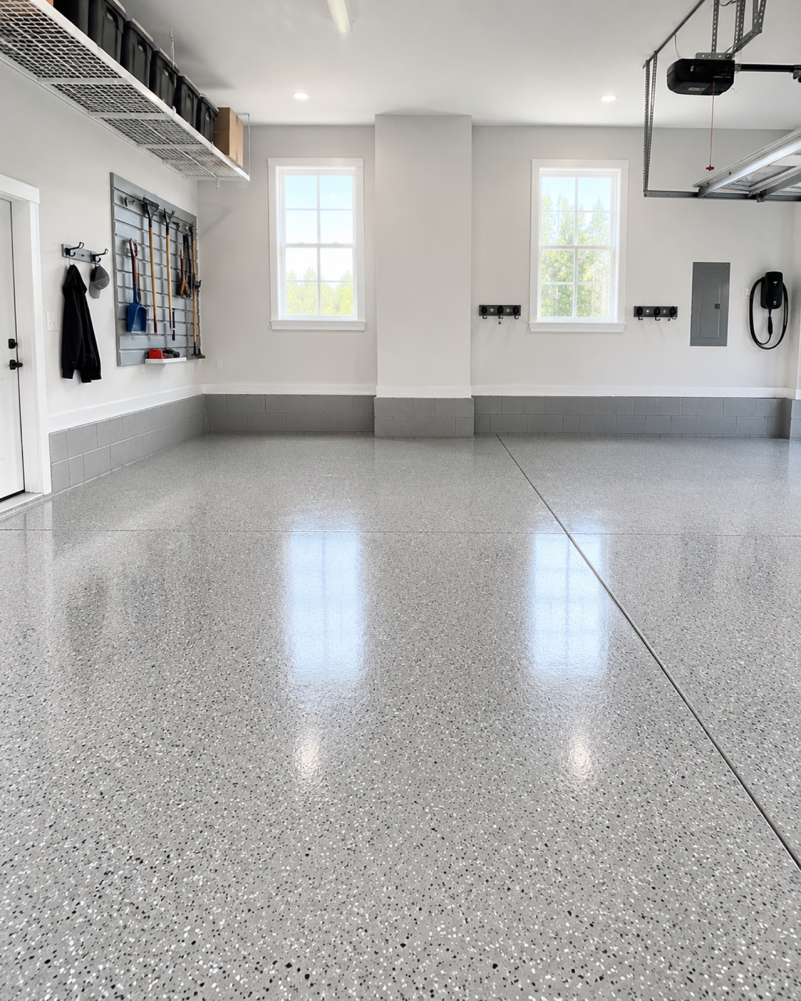 Full-broadcast gray flake epoxy floor finish in a Grand Forks garage